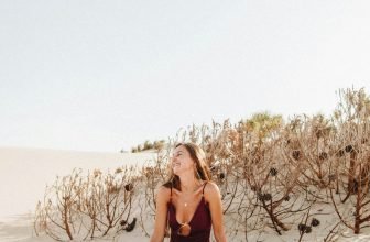 woman sitting on sand